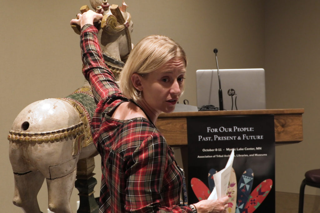 A woman demonstrates work on a sculpture at Mystic Lake Casino