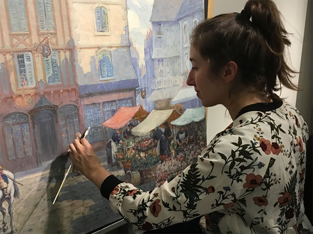 Alexa Beller working on an oil painting