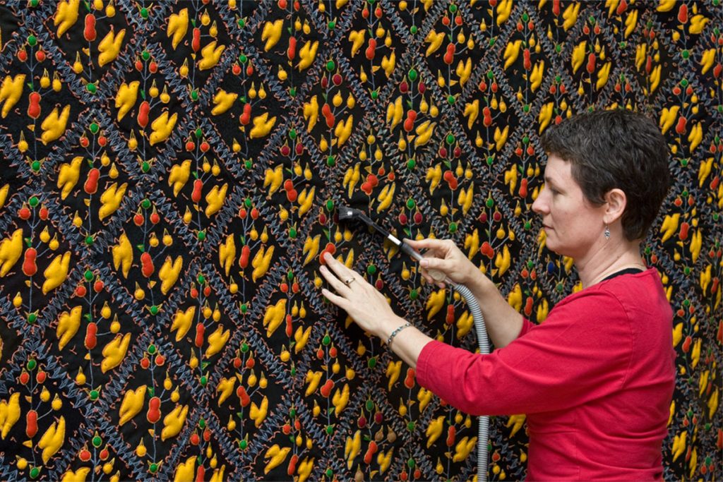 Demonstrating cleaning a large textile